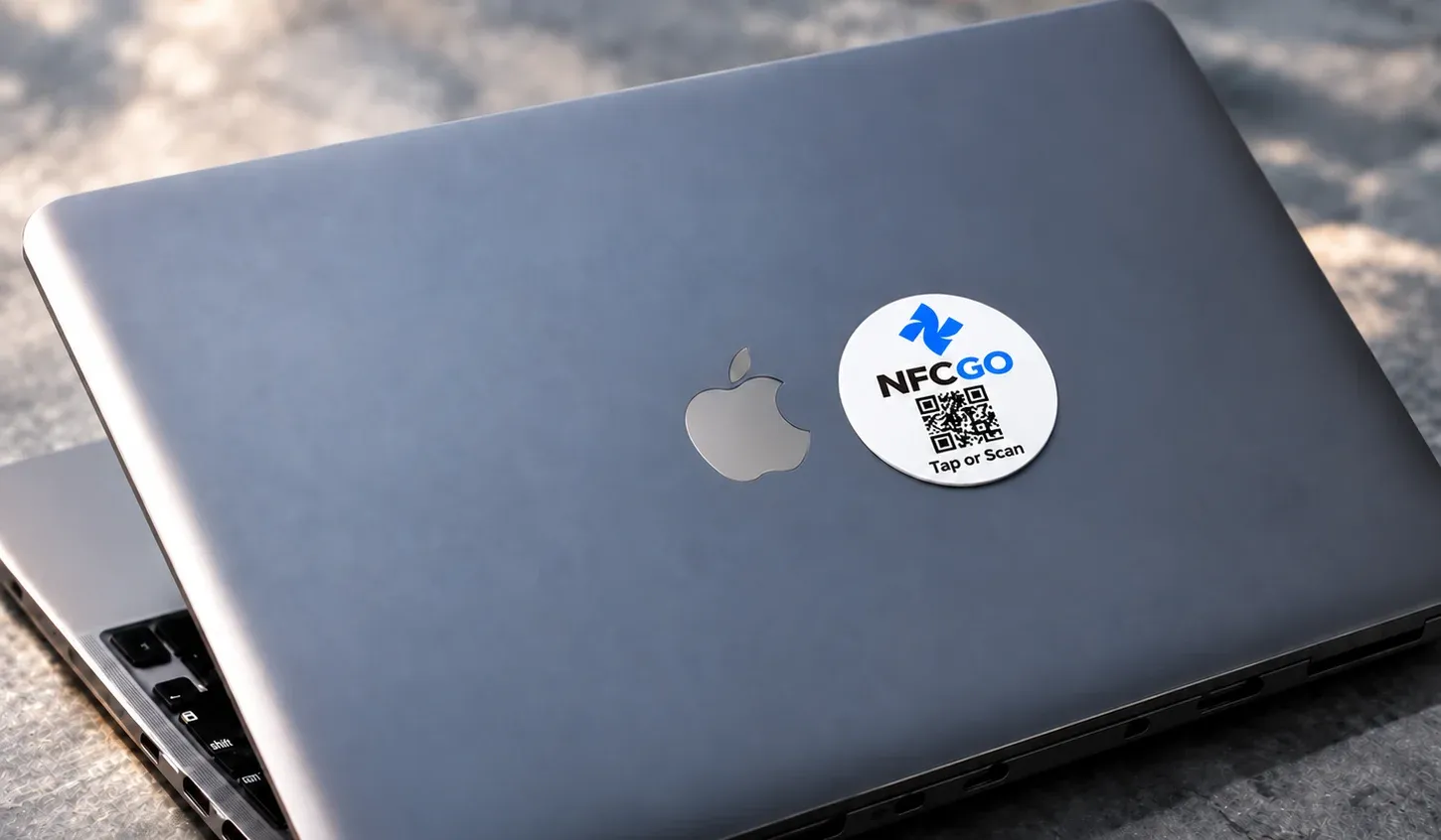 An NfcGo tag on a laptop
